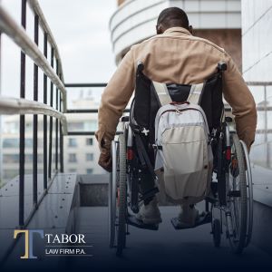 Social Security disability lawyer – man in wheelchair navigating accessibility ramp.